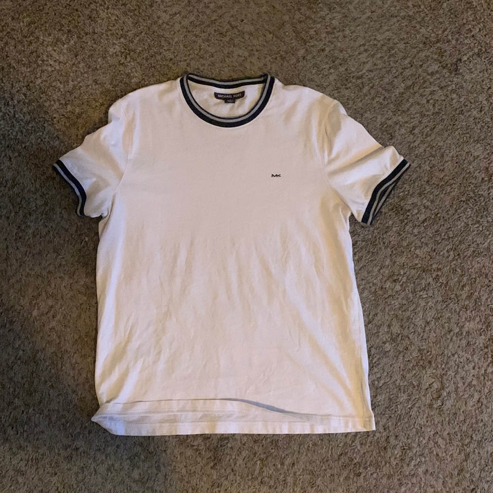 White T-shirt with black and sliver on the neck and are sleeves